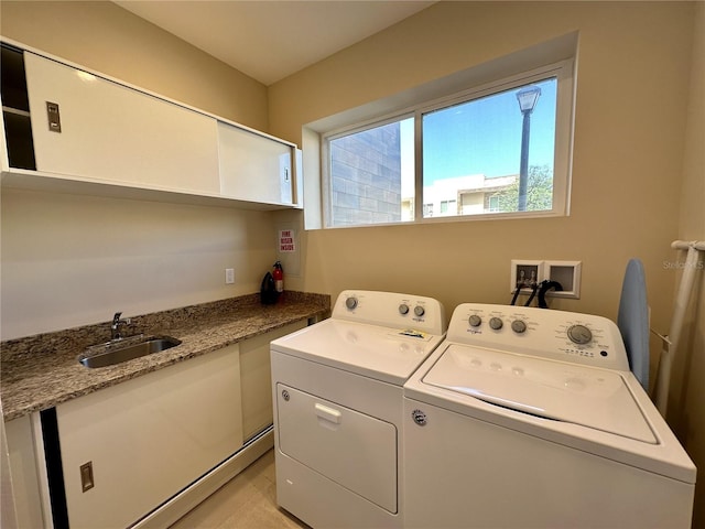 laundry area with sink and washer and clothes dryer