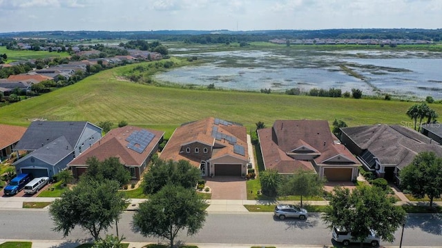 bird's eye view with a residential view and a water view