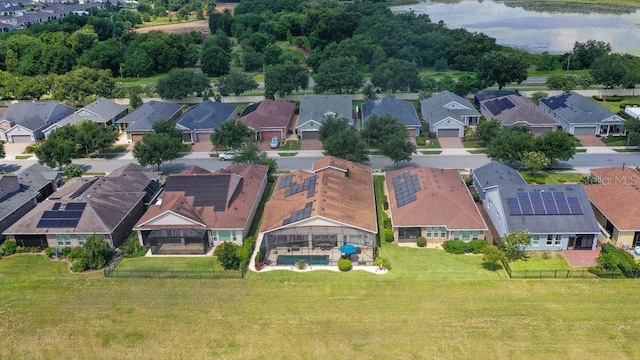 drone / aerial view featuring a residential view and a water view