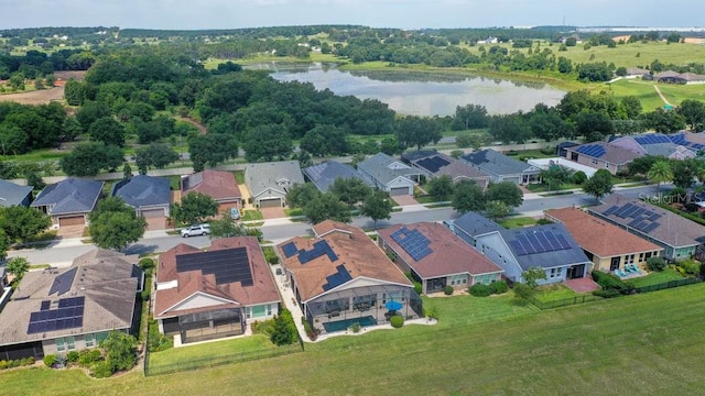 drone / aerial view with a water view and a residential view