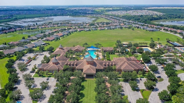 drone / aerial view featuring a residential view and a water view