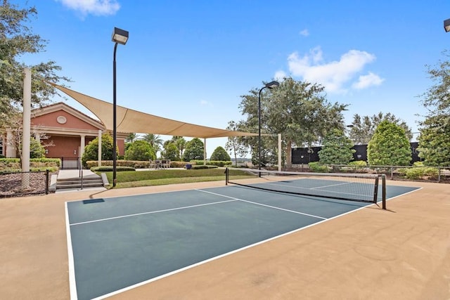 view of sport court with fence