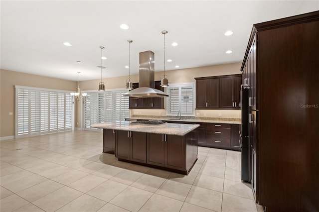 kitchen featuring a kitchen island, dark brown cabinetry, recessed lighting, island exhaust hood, and a sink