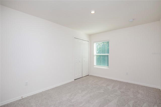 18059 Regan Ave, Port Charlotte, FL 33948 - unfurnished room featuring carpet floors, baseboards, and recessed lighting
