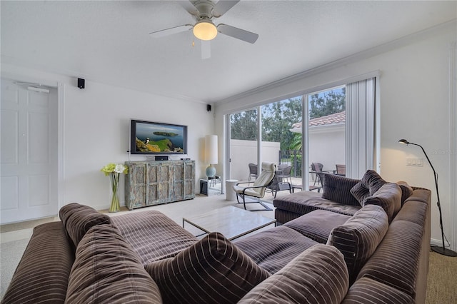 carpeted living room with ceiling fan