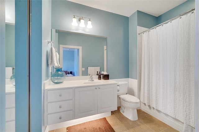 full bathroom with vanity, toilet, and shower / bath combo