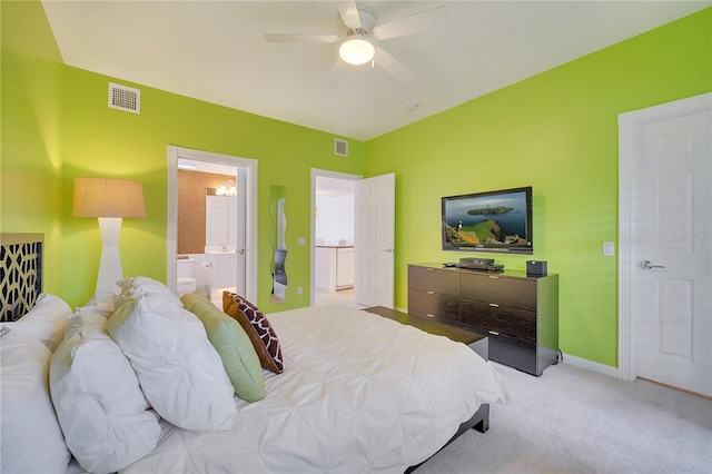 bedroom featuring light colored carpet, connected bathroom, and ceiling fan