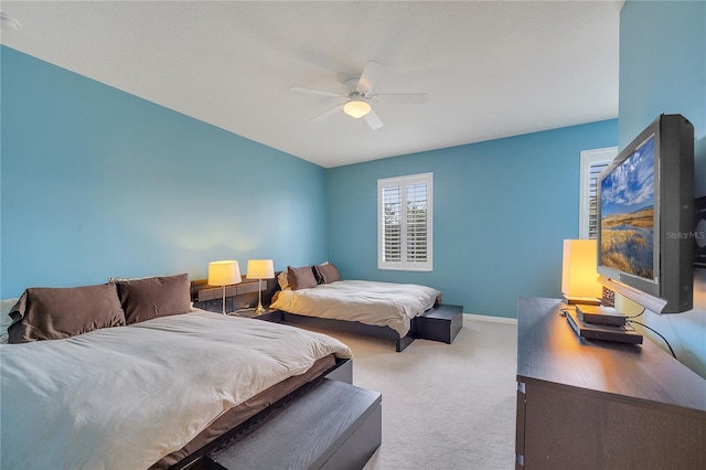 bedroom with ceiling fan and carpet