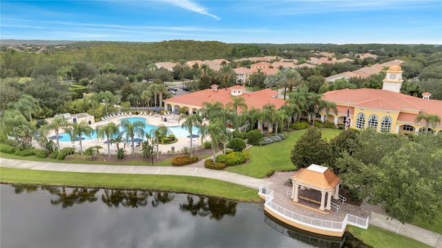 birds eye view of property with a water view