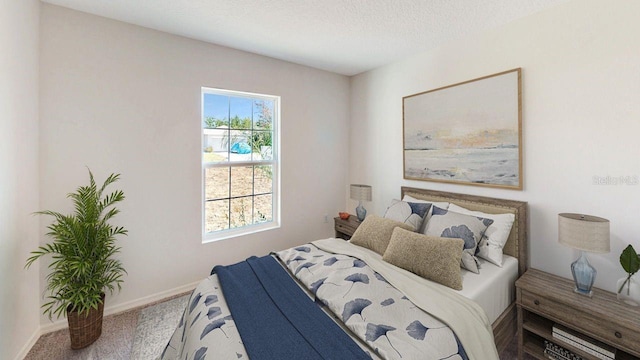 bedroom with carpet floors and a textured ceiling