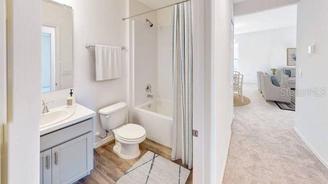 full bathroom featuring toilet, shower / bath combination with curtain, vanity, and wood-type flooring