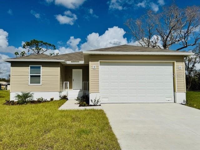 17384 Robinson Ave, Port Charlotte, FL 33948 - ranch-style house with concrete driveway, a garage, and a front lawn