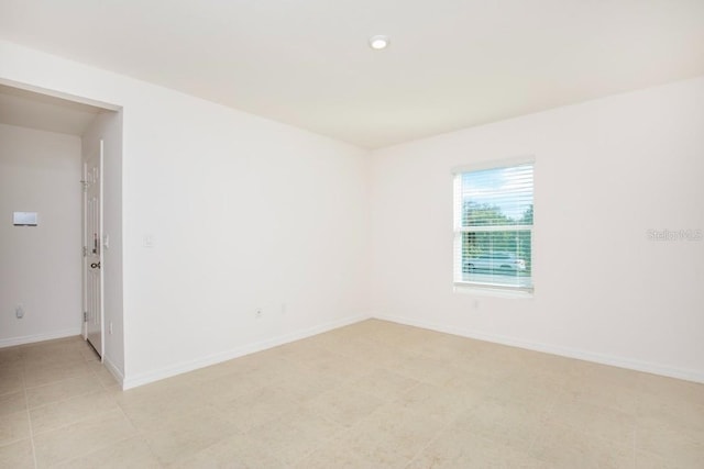 17384 Robinson Ave, Port Charlotte, FL 33948 - spare room featuring baseboards and recessed lighting