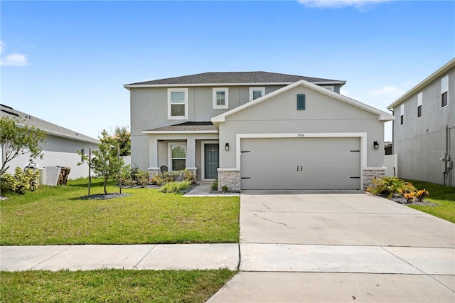 view of front facade with a garage and a front lawn