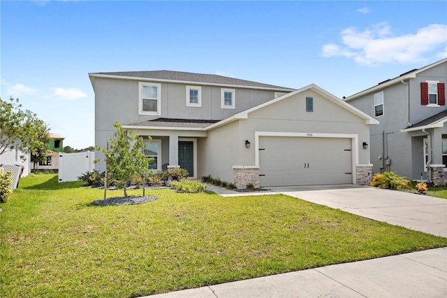 view of front of property featuring a front yard and a garage