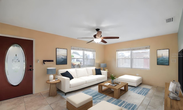 living room with light tile patterned floors and ceiling fan