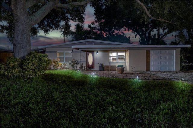 ranch-style house featuring a garage