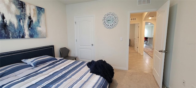 bedroom featuring light colored carpet