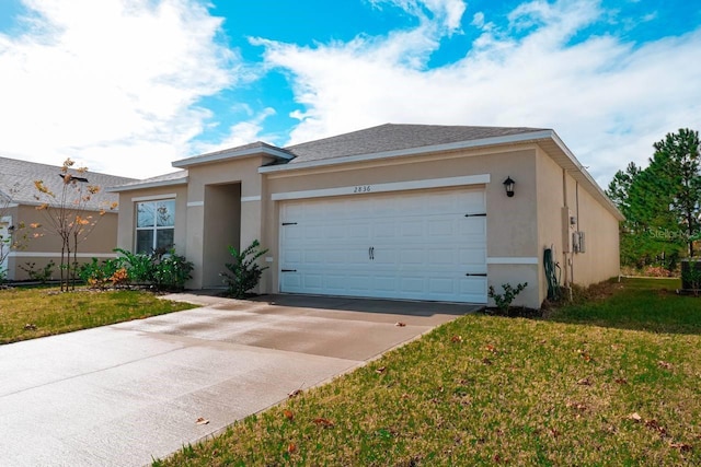 view of front of house with a garage and a front lawn