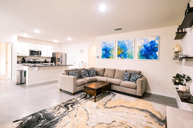 living room featuring light tile patterned floors