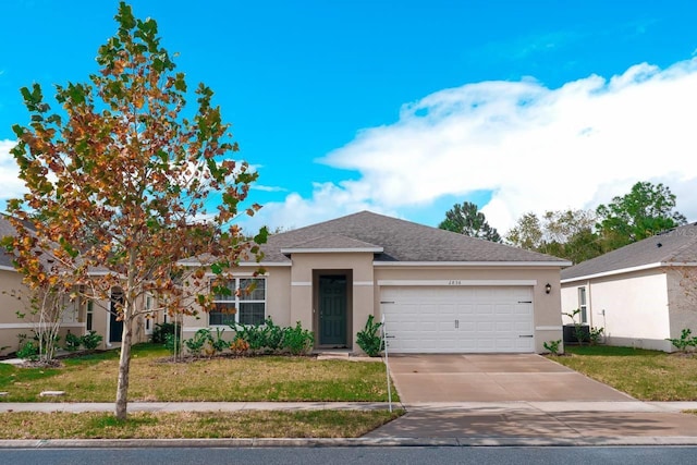 view of front of house featuring a front yard and a garage