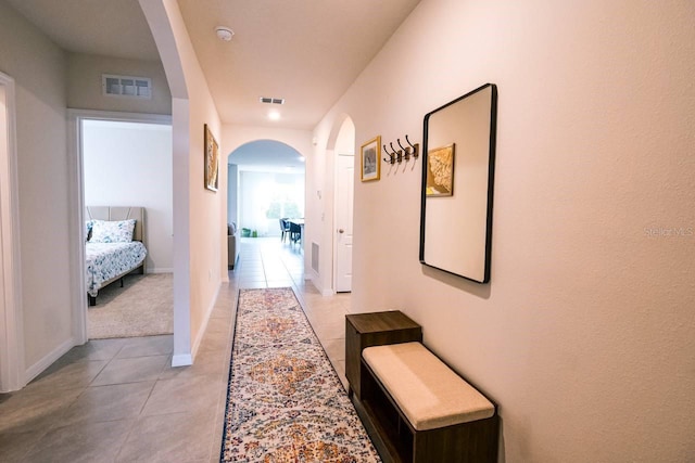 hall with light tile patterned flooring