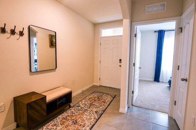 entryway featuring light tile patterned flooring