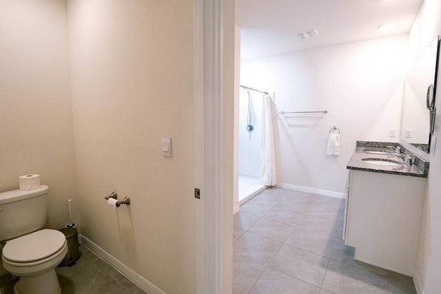 bathroom with tile patterned flooring, vanity, a shower with shower curtain, and toilet