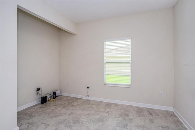 interior space with light tile patterned flooring and a wealth of natural light