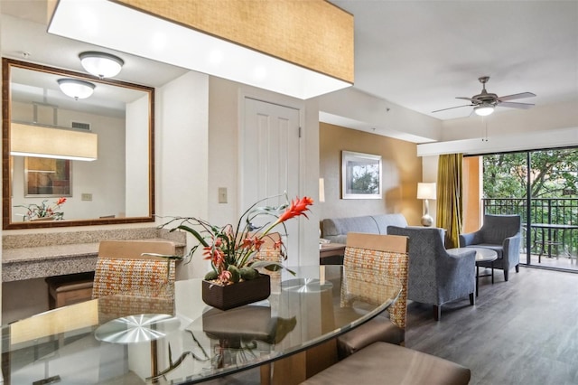 dining room with ceiling fan and hardwood / wood-style floors