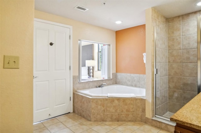 bathroom with independent shower and bath, tile patterned flooring, and vanity