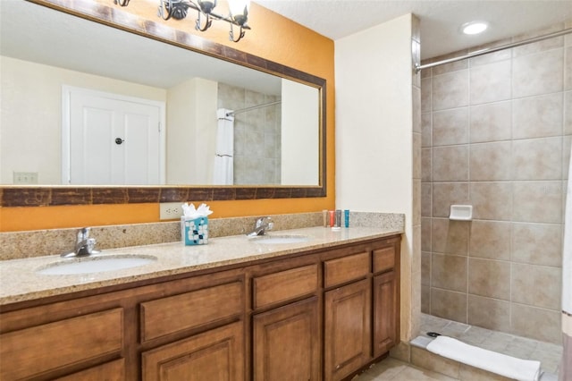 bathroom featuring vanity and a tile shower