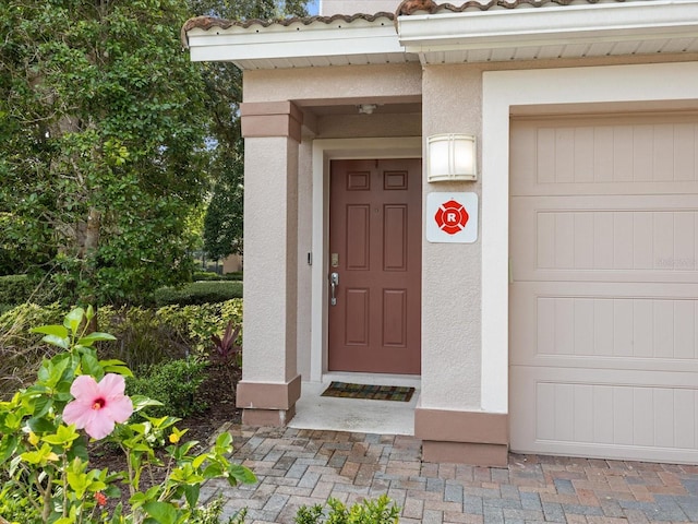 property entrance featuring a garage