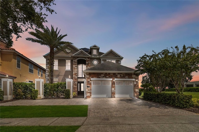 view of front of home featuring a yard and a garage