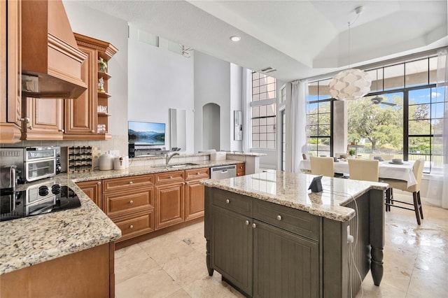 kitchen with light tile patterned floors, premium range hood, a kitchen island, and light stone countertops