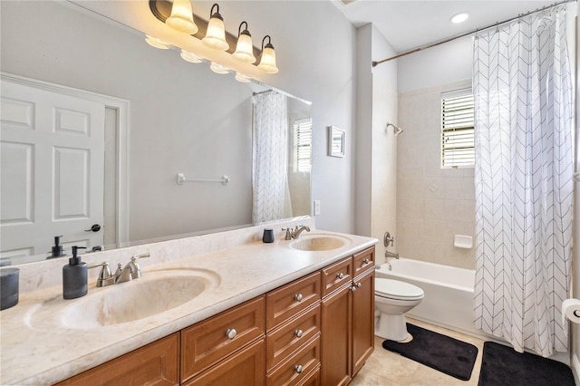 full bathroom featuring shower / bath combo with shower curtain, double vanity, tile patterned floors, and toilet