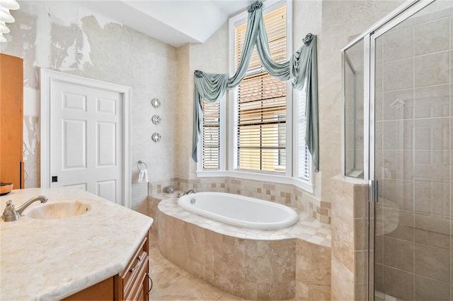 bathroom with tile patterned floors, vanity, and plus walk in shower