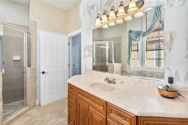 bathroom with tile patterned floors, walk in shower, and vanity