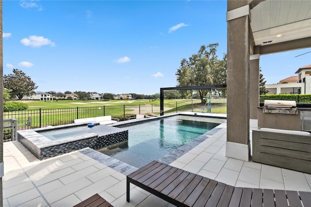 view of swimming pool with a yard, an in ground hot tub, a patio area, and area for grilling