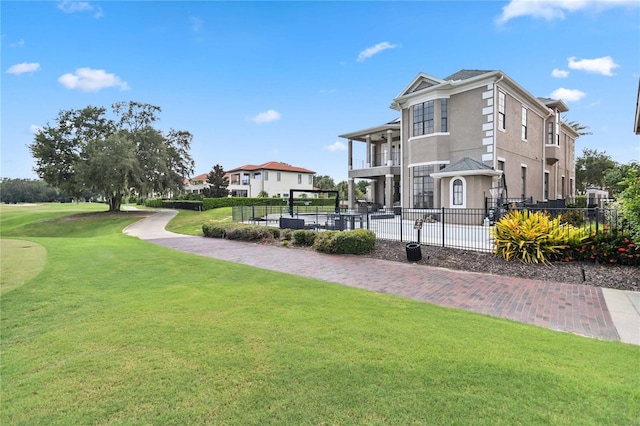 view of home's community featuring a lawn