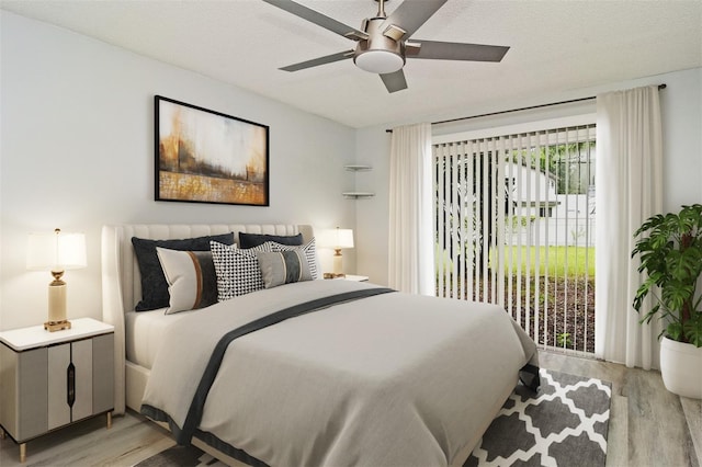 bedroom with a textured ceiling, access to outside, ceiling fan, and light hardwood / wood-style flooring