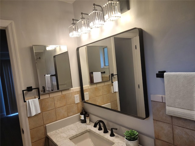 bathroom featuring decorative backsplash and vanity