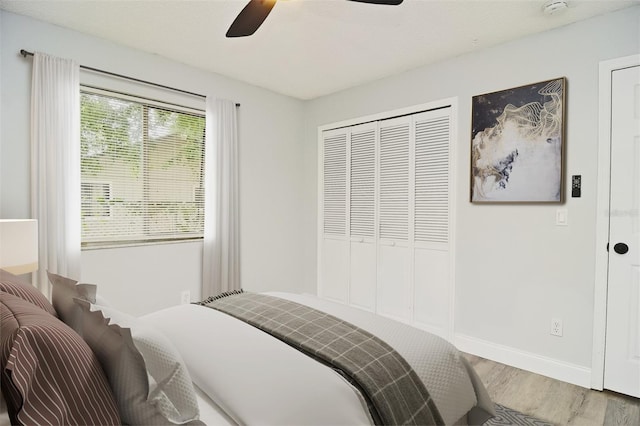 bedroom featuring a closet, ceiling fan, and hardwood / wood-style floors