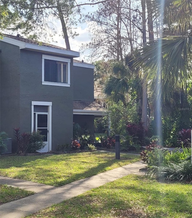 view of home's exterior featuring a lawn