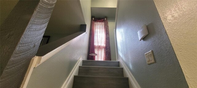 staircase featuring a wealth of natural light