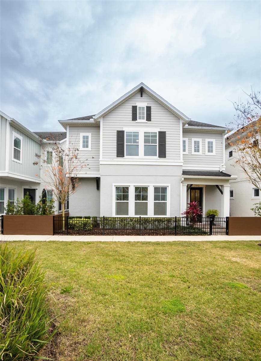 view of property featuring a front yard