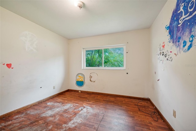 empty room with hardwood / wood-style floors