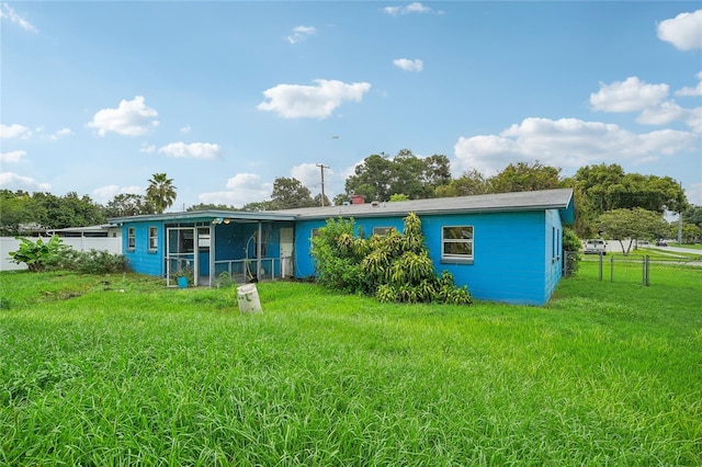 back of house with a yard