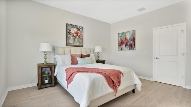 bedroom featuring light hardwood / wood-style floors