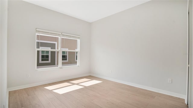 unfurnished room featuring light hardwood / wood-style flooring